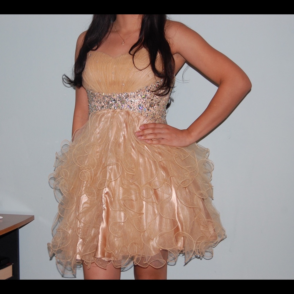 Short gold dress with lace up back