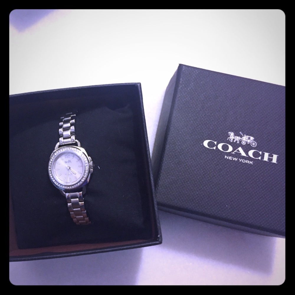 COACH TATUM sunray dial set bracelet watch.