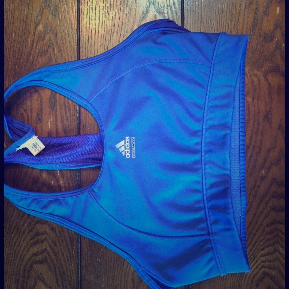 Blue woman's adidas tech-fit sports bra .