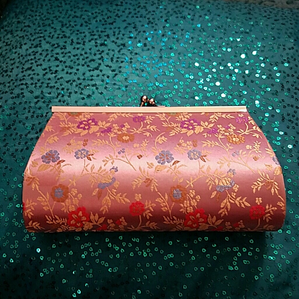 Pink silk clutch with a floral design