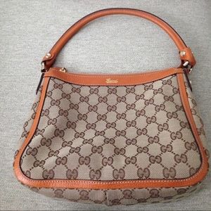 Gucci monogramed shoulder bag.