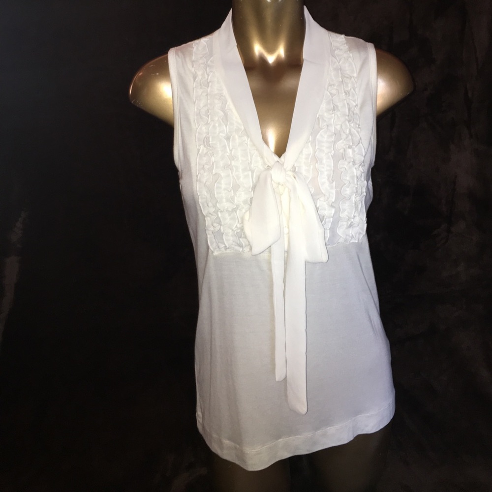 Cream colored tie front with ruffles top