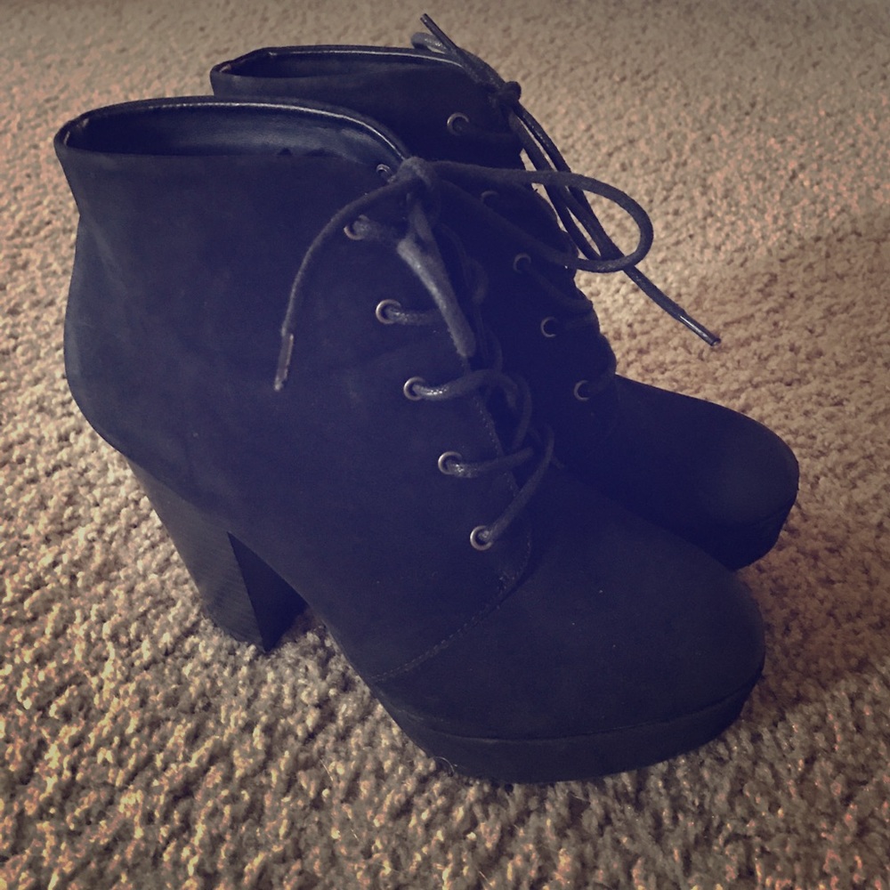 Black heeled lace up booties