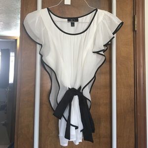 Small black & white sleeveless blouse. Never worn.