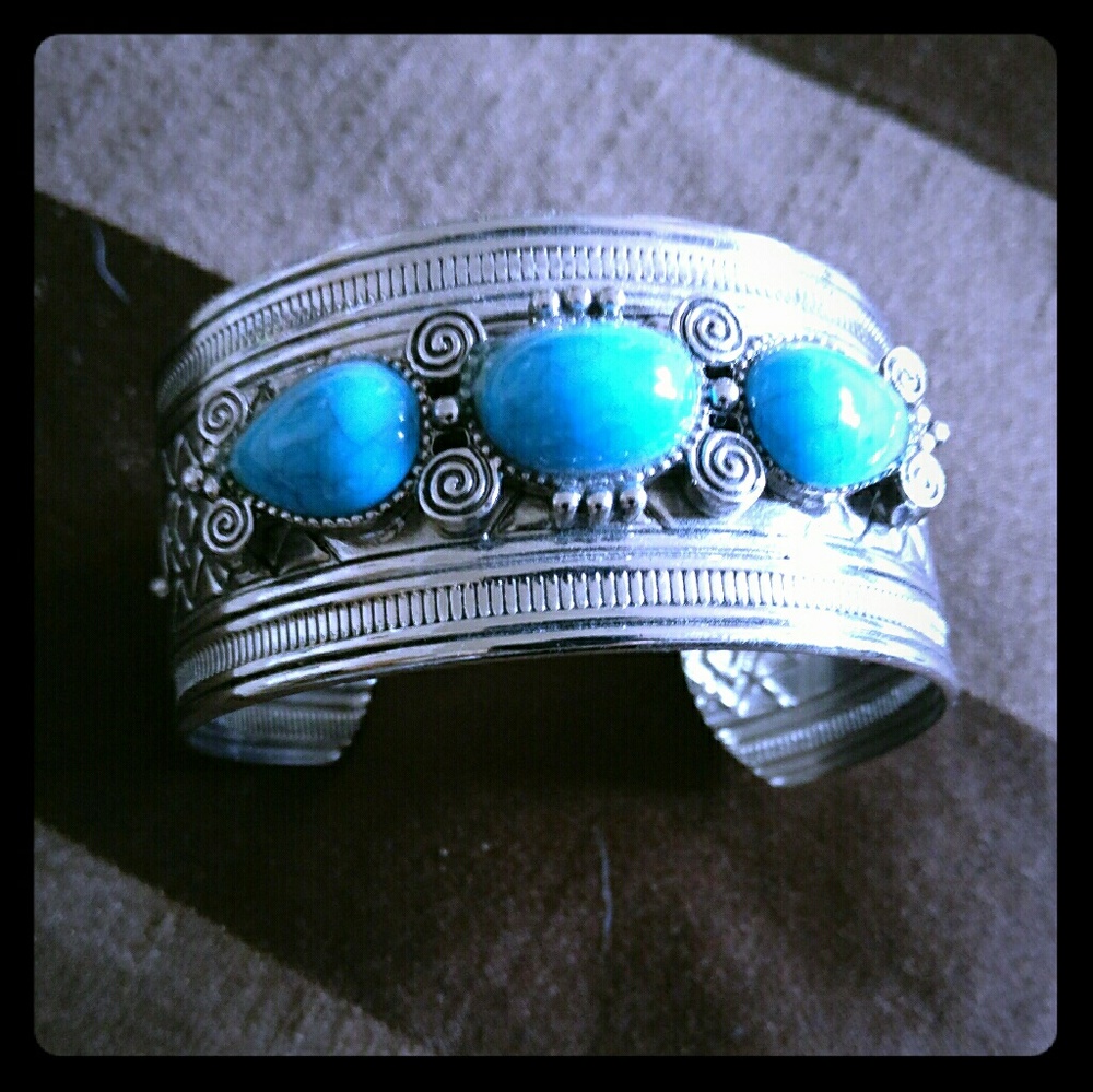 Two matching metal cuffs