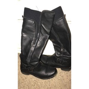 Black leather boots with buckles.