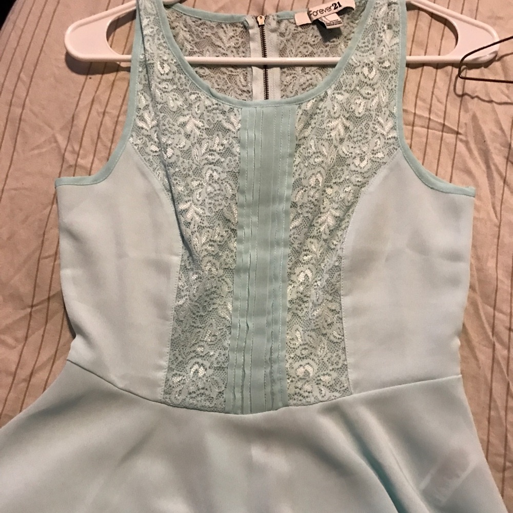 A light teal or light blue summer dressy shirt