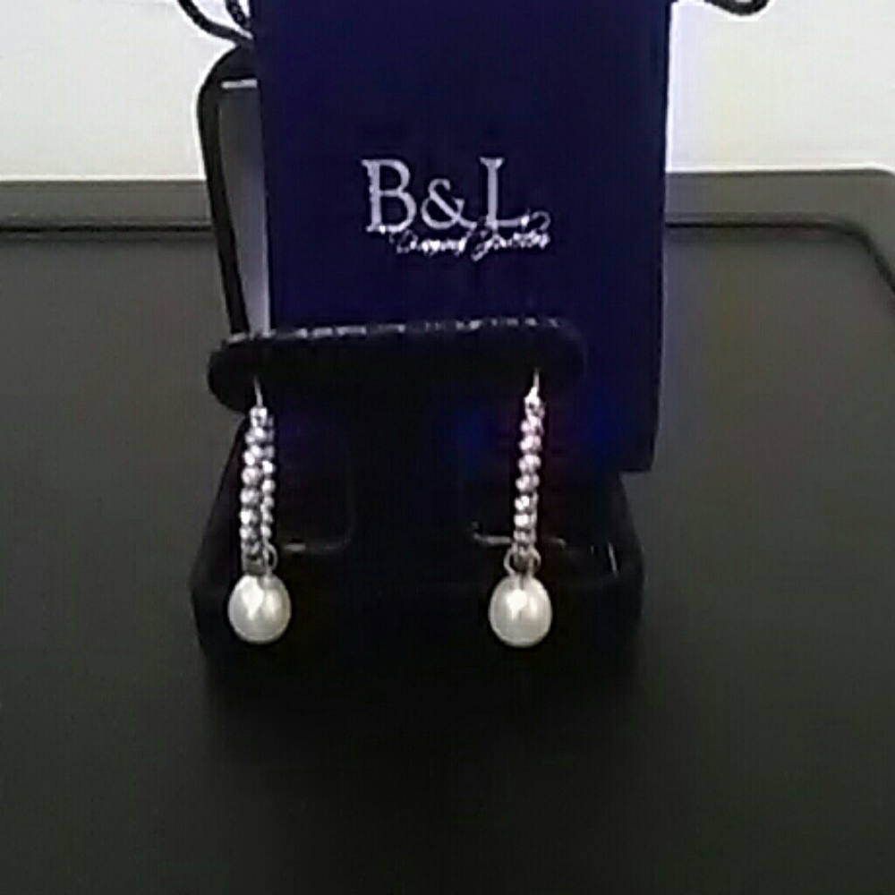 Brand New Beautiful sterling silver hoop earrings.