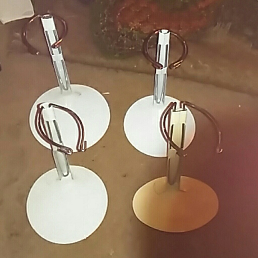 4 white. Doll stands (i have more if interested)