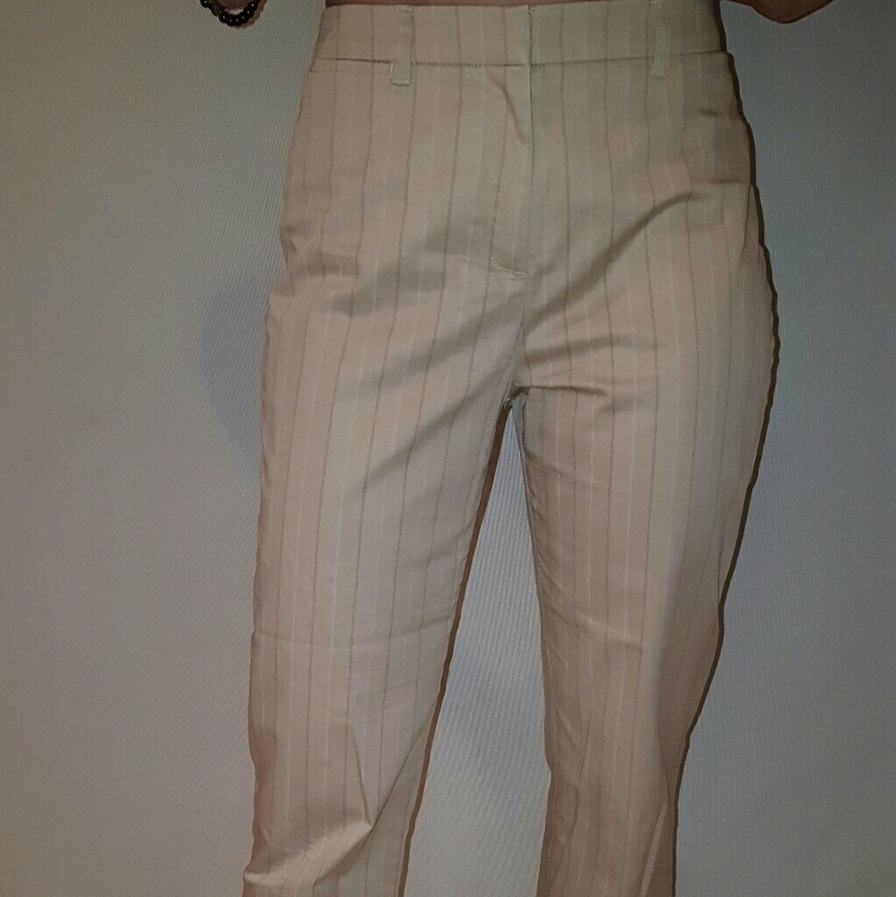 Cream colored pinstripe capris.