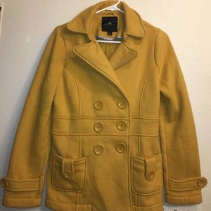 Mustard yellow coat.