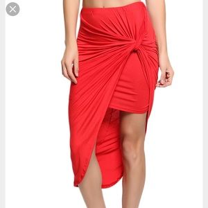 red knotted asymmetrical skirt