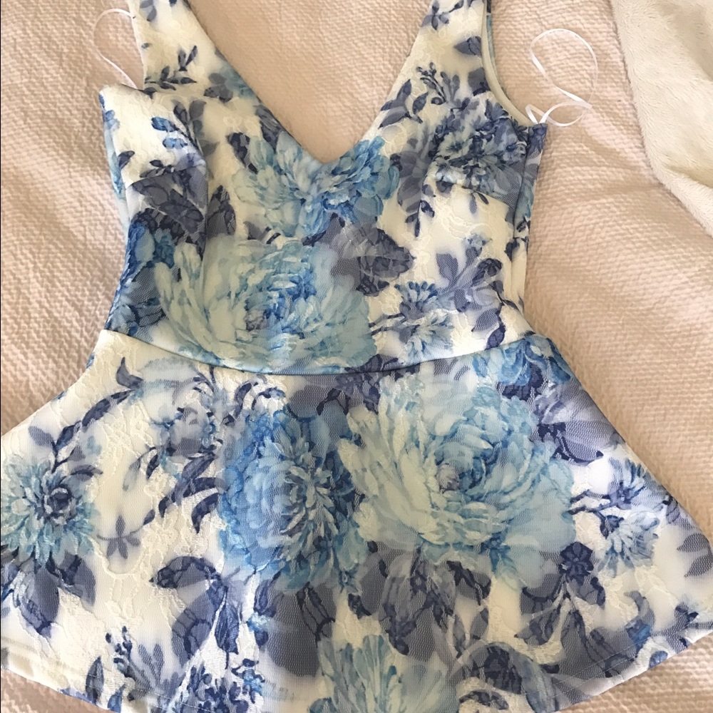 Beautiful white and blue flowered peplum top
