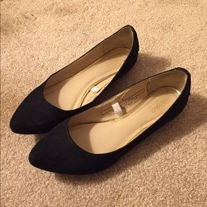 Regular black flats with stone detailing.