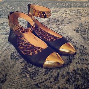 Gold and black flats