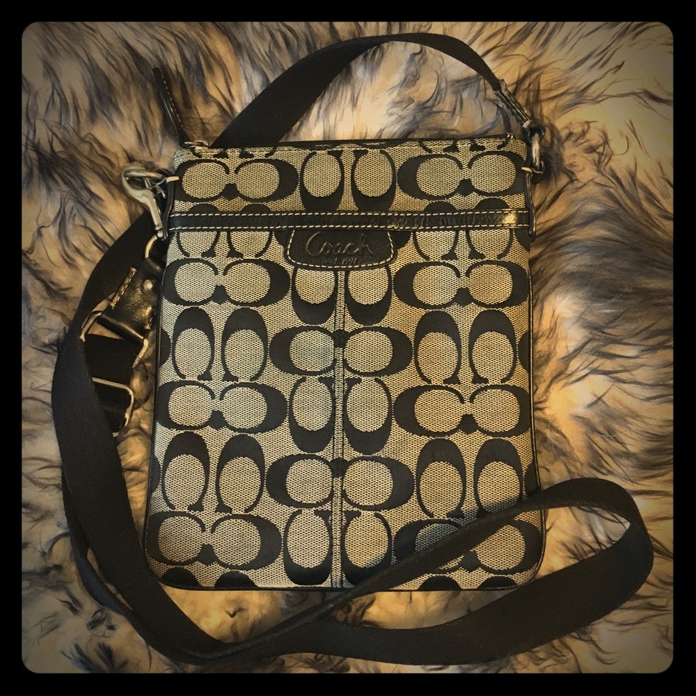 Grey and black Coach cross-body purse