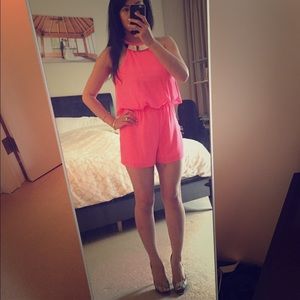 Neon pink romper with gold neck piece! 🌟