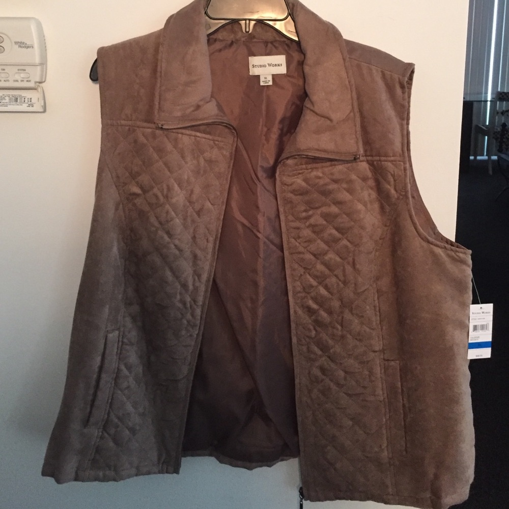 Tan quilted sleeveless vest.