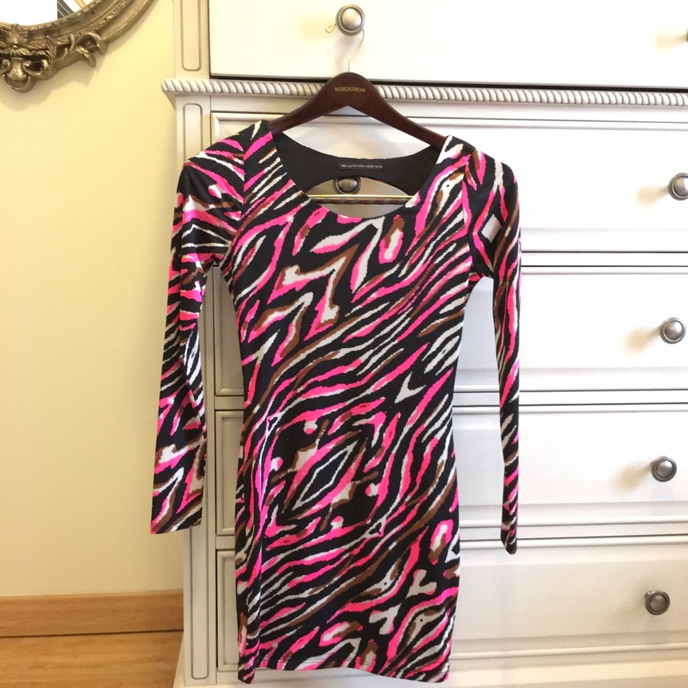 Long sleeve cocktail dress with open back.