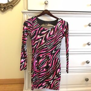 Long sleeve cocktail dress with open back.