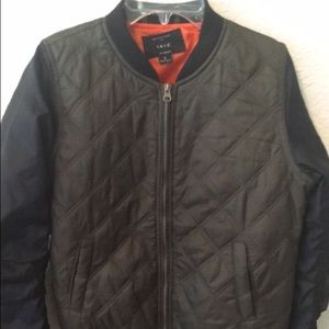 small green bomber jacket with zips on sleeves