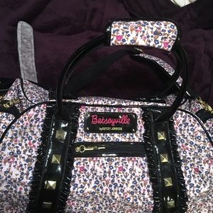 Betsy Johnson carry on/rolling case suitcase