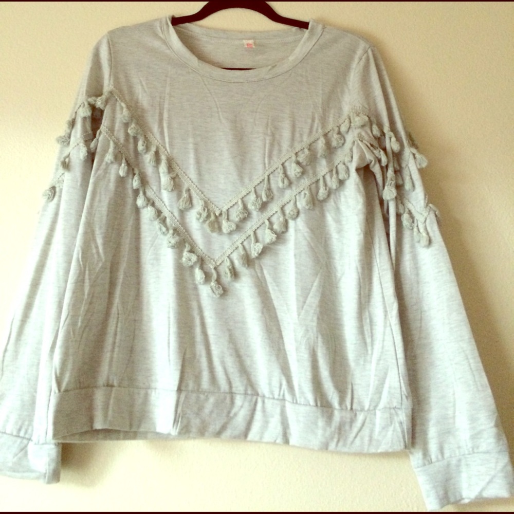 Crew neck sweater with tassle detail