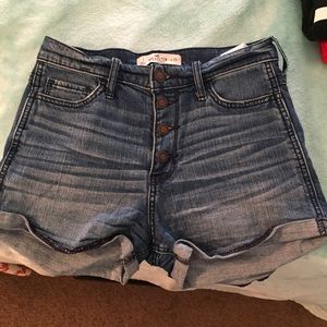 High waisted blue jean shorts with buttons