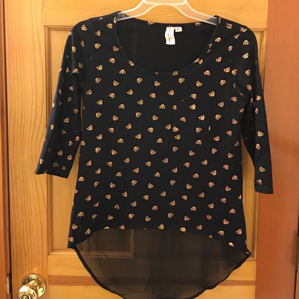 Black and gold skull top with sheer back.