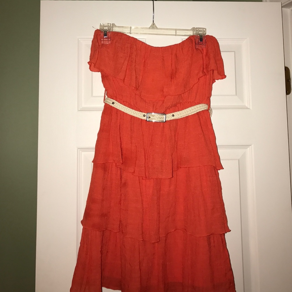 A Byer Coral Strapless Belted Dress.
