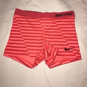 orange and red striped dry fit nike pros