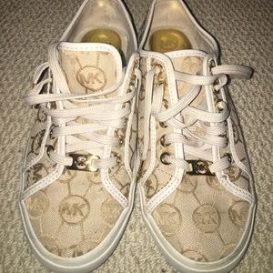 white and gold MK sneakers