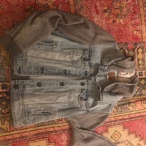 Distressed denim jacket with hoodie attachment