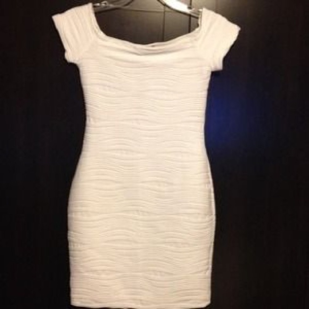 Textured white body-con dress.