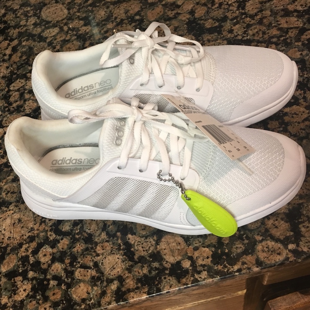 All white adidas tennis/running shoes
