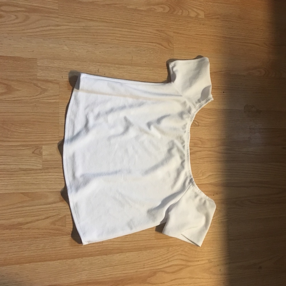 A white shirt that hangs down on the shoulder