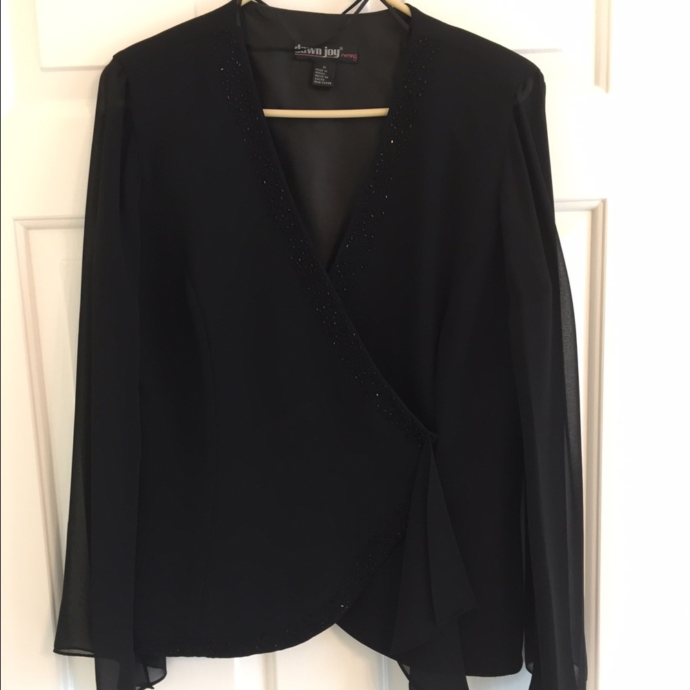 Dressy top with beaded accent & shear sleeve.
