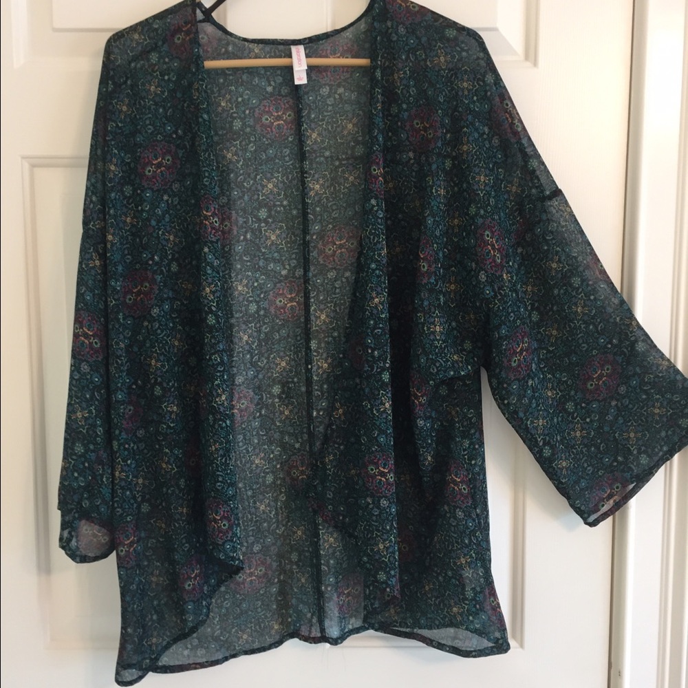 Sheer cover up. Dressy.