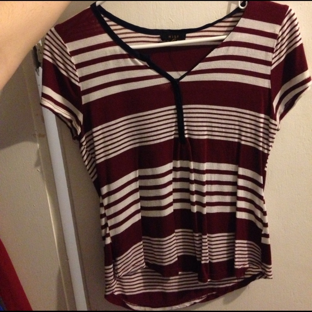 Maroon striped shirt.