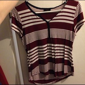 Maroon striped shirt.
