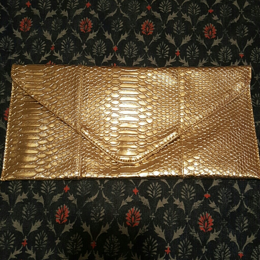 Gold snakeskin clutch