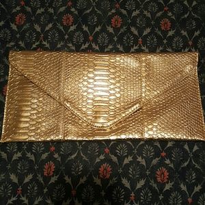 Gold snakeskin clutch