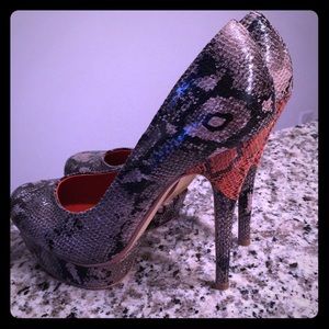 Snakeskin platform Pumps with corral detail.