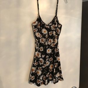 Floral romper with bow tie detail on the back
