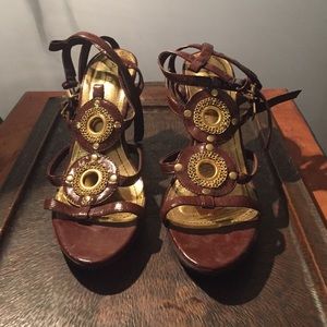 Brown and gold patent leather heels