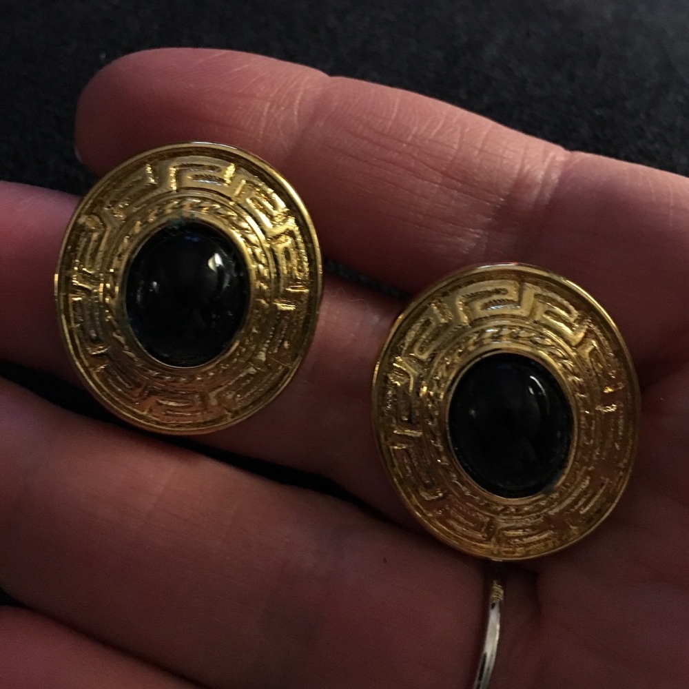 Gold-tone pierced earrings with black/blue stone