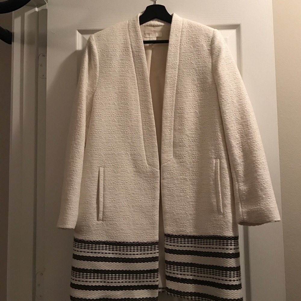cream and black textured coat