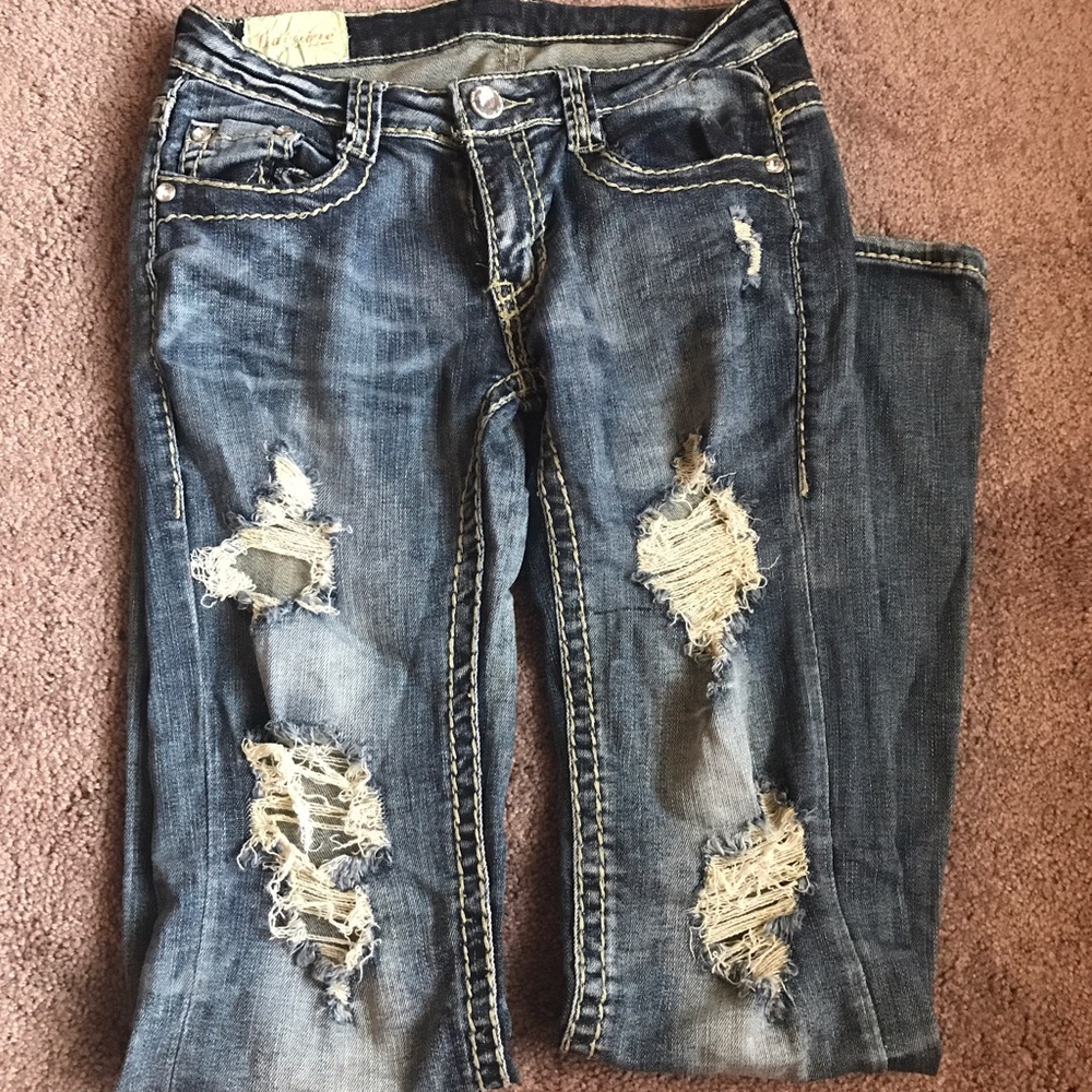 Distressed jeans.