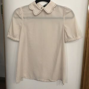 Sheer cream colored blouse with scalloped collar