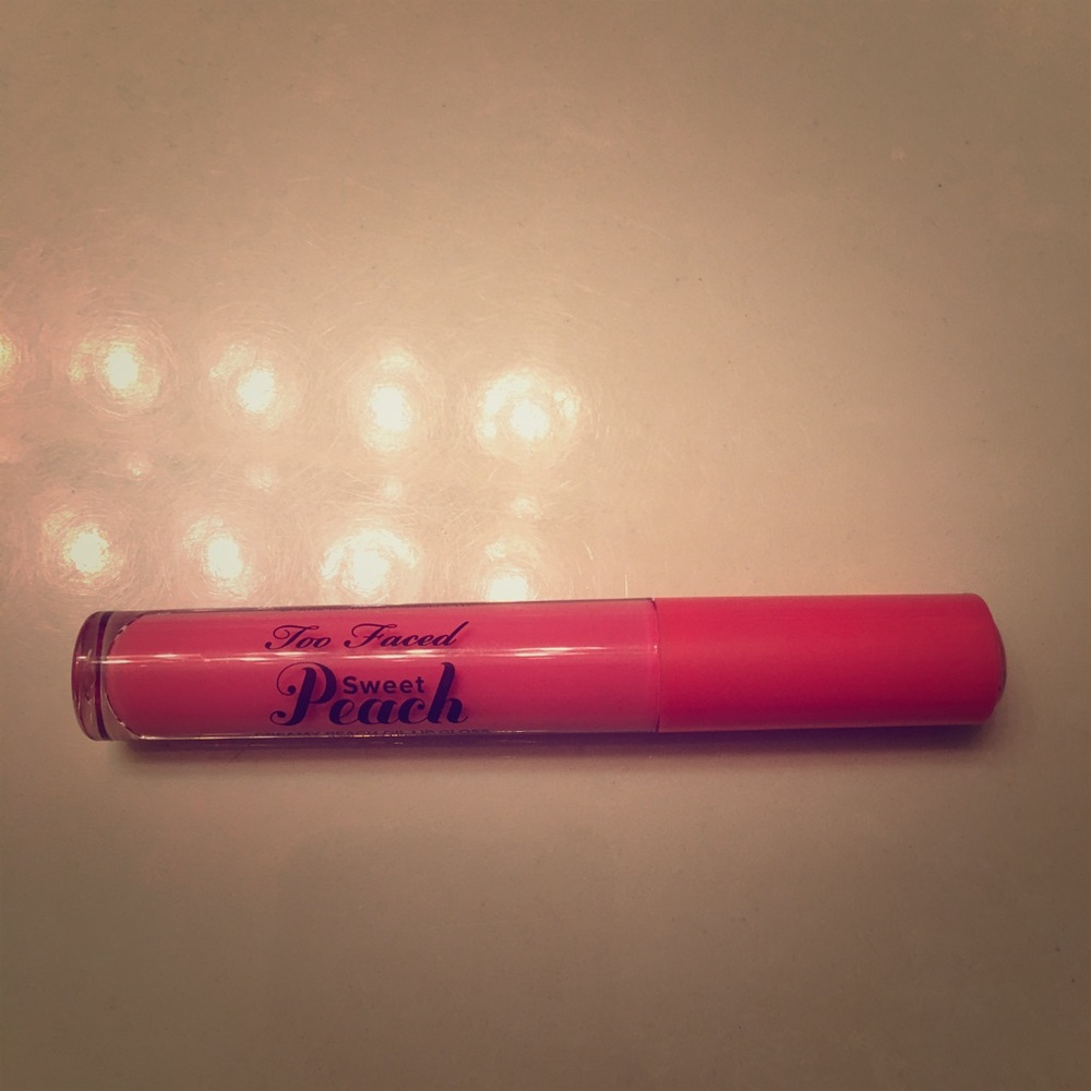Too faced Just Peachy lip gloss in peach, please